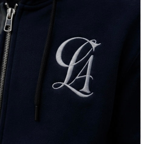 CLASIFY monogram embroidery detail on navy fabric