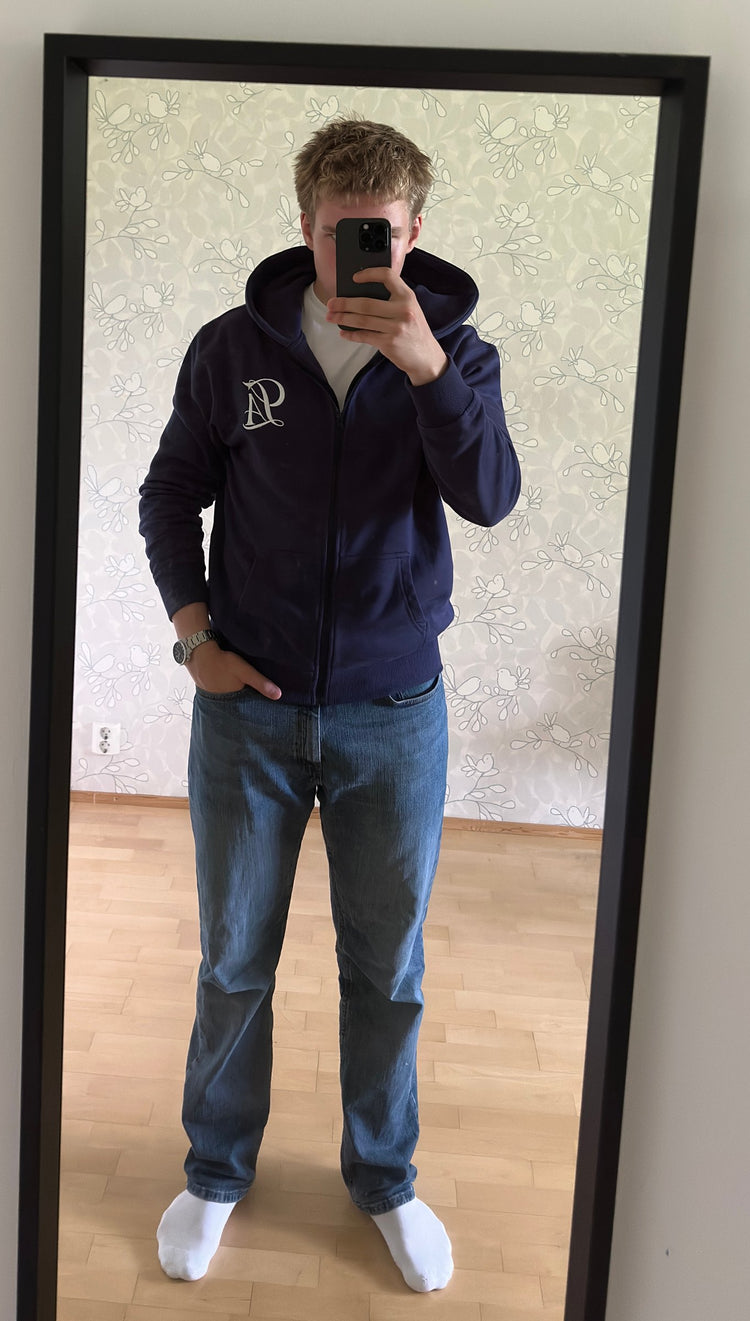 Olli wearing the first navy Clasify Zip Hoodie